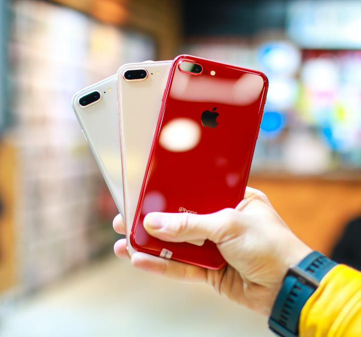 person holding red iphone case